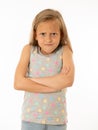 Pretty little girl with a angry facial expression looking mad at the camera. Human emotions Royalty Free Stock Photo