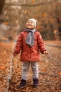 Pretty little girl in autumn park