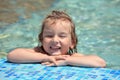 Pretty little girl bathe in pool, closed eyes