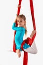 Pretty little girl in a blue gymnastic suit Royalty Free Stock Photo