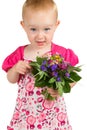 Pretty little girl with a bunch of garden flowers Royalty Free Stock Photo