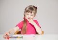 Pretty little girl choosing a marker Royalty Free Stock Photo