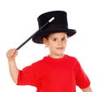 Pretty little girl doing magic with a top hat and a magic wand Royalty Free Stock Photo