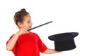 Pretty little girl doing magic with a top hat and a magic wand Royalty Free Stock Photo