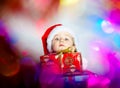 Pretty little girl dressed in santa red hat, new year portrait w Royalty Free Stock Photo