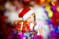 Pretty little girl dressed in santa red hat, new year portrait w Royalty Free Stock Photo