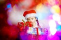 Pretty little girl dressed in santa red hat, new year portrait w Royalty Free Stock Photo