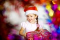 Pretty little girl dressed in santa red hat, new year portrait w Royalty Free Stock Photo