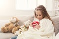 Beautiful little girl drinking tea at home Royalty Free Stock Photo