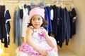Pretty little girl in funny hat and dress in Royalty Free Stock Photo