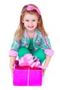 Pretty little girl with a gift in their hands Royalty Free Stock Photo