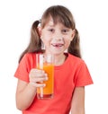 Pretty little girl with a glass of juice