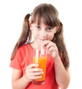 Pretty little girl with a glass of juice