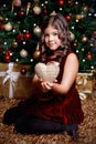 Pretty little girl holding a Christmas ornament Royalty Free Stock Photo