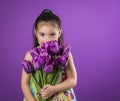 Small girl holding large bouquet