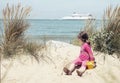 Pretty little girl making sandcastles on the beaches of Hauts-de-France Royalty Free Stock Photo