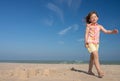 Pretty little girl making sandcastles on the beaches of Hauts-de-France Royalty Free Stock Photo