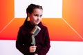 pretty little girl with the microphone in her hand Royalty Free Stock Photo