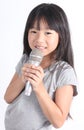 Pretty little girl with the microphone in her hand Royalty Free Stock Photo