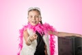 A pretty little girl with a pink feather boa Royalty Free Stock Photo