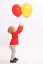 Pretty little girl is playing with balloons Royalty Free Stock Photo