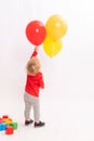 Pretty little girl is playing with balloons Royalty Free Stock Photo