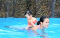 Pretty little girl playing in swimming pool outdoors Royalty Free Stock Photo