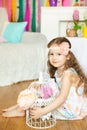 Pretty little girl n a spring easter studio decorations