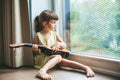 Pretty little girl playing ukulele Royalty Free Stock Photo