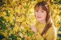 Outdoor fashion portrait of funny 9-10 year old girl