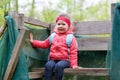 Pretty little girl relax at beauty summer landscape background Royalty Free Stock Photo