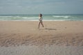 Pretty little girl running on the beaches of Hauts-de-France Royalty Free Stock Photo