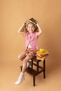 Pretty little girl schoolgirl with books and apple. School concept. Back to School. World books day Royalty Free Stock Photo