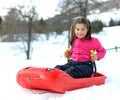 Pretty little girl with ski suit with the bob Royalty Free Stock Photo