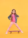 Pretty little girl standing on yellow background Royalty Free Stock Photo