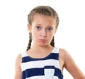 Pretty little girl in striped dress studio portrait, making a surprised face, white background