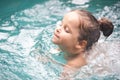 Pretty little girl in swimming pool Royalty Free Stock Photo