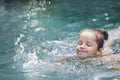 Pretty little girl in swimming pool Royalty Free Stock Photo