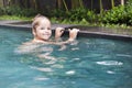 Pretty little girl in swimming pool Royalty Free Stock Photo