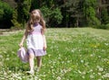 Pretty little girl walking in a park Royalty Free Stock Photo