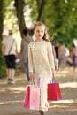 Pretty little girl walking with the pink shopping bags Royalty Free Stock Photo