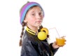 a pretty little girl with a woolen cap drinking a glass of orange juice Royalty Free Stock Photo