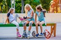 Little girls putting on rollerskates Royalty Free Stock Photo