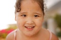 Kazakh little girl playing near swimming pool