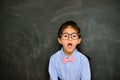 Pretty little teacher shocked looking at camera