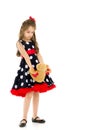 Pretty Long Haired Girl Wearing Polka Dot Dress Posing with Teddy Bear Royalty Free Stock Photo