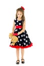 Pretty Long Haired Girl Wearing Polka Dot Dress Posing with Teddy Bear Royalty Free Stock Photo