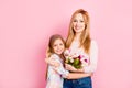 Pretty, lovely mom and daughter celebrating women`s day, embraci Royalty Free Stock Photo