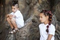 Thoughtful boy and girl by the tree Royalty Free Stock Photo