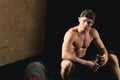 Pretty man tired after weightlifting at gym Royalty Free Stock Photo